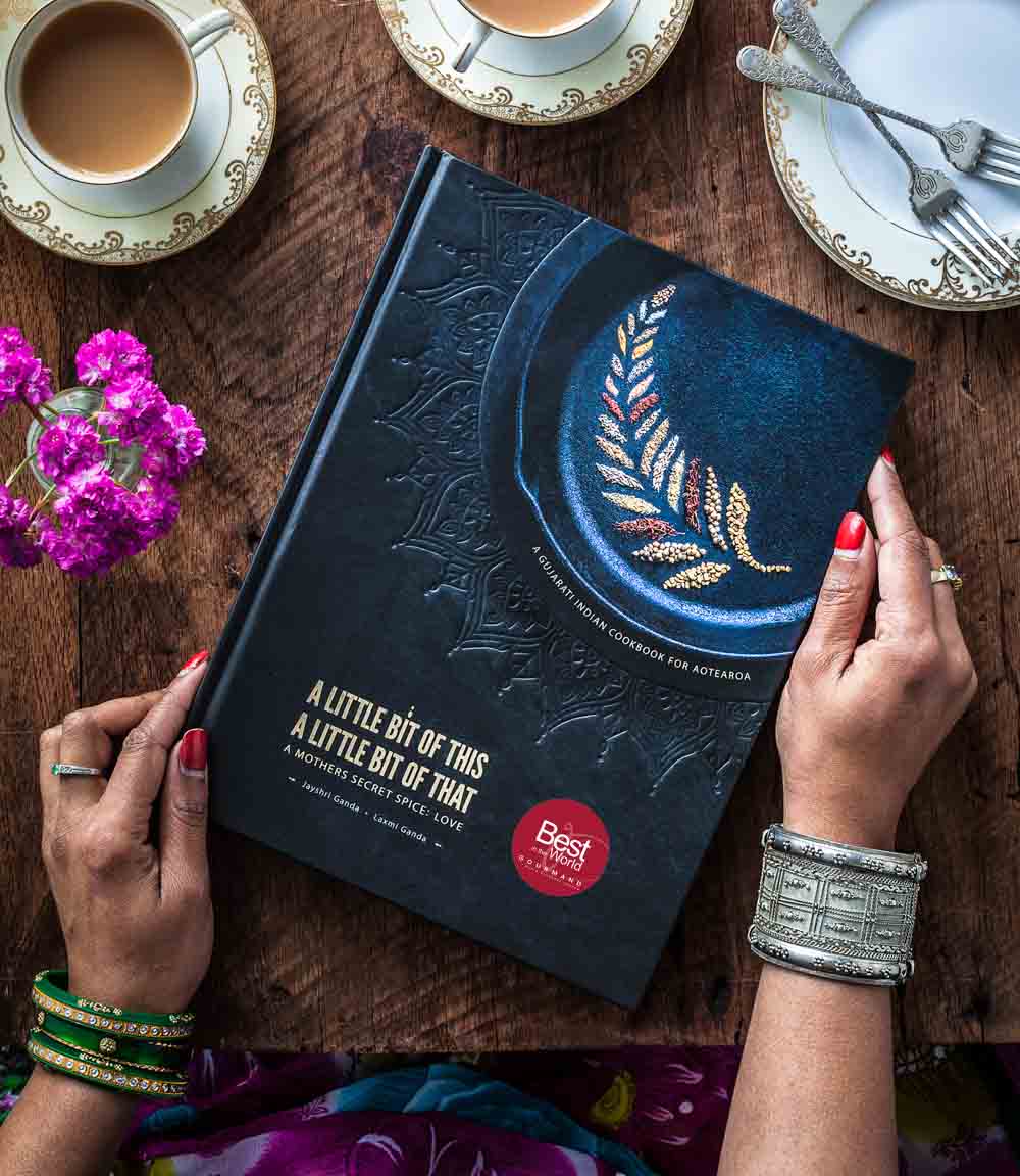A little bit of this, a little bit of that Gujarati Indian Cookbook from New Zealand. A mother's secret spice; love. By Laxmi and Jayshri Ganda - Mother Daughter duo - Front cover design, with gourmand award winning award
