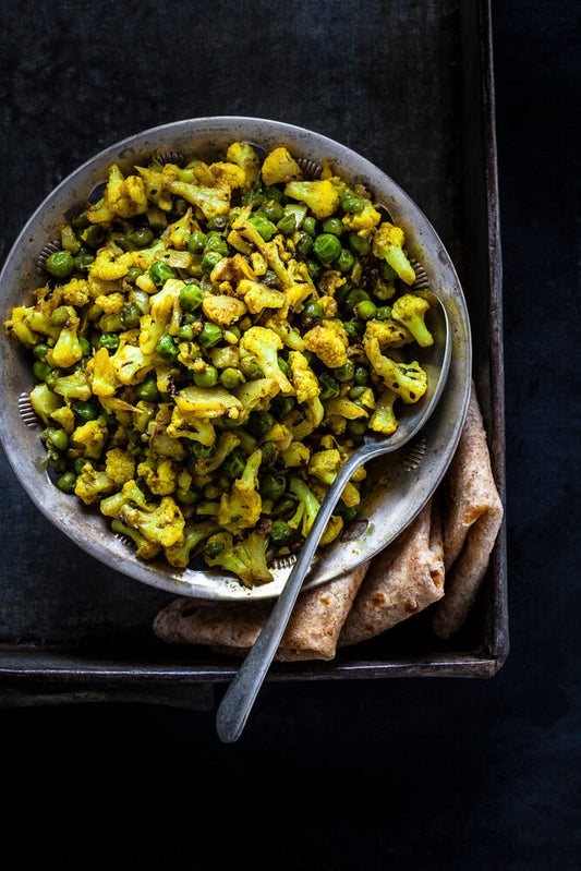 STIR FRIED CAULIFLOWER AND PEAS