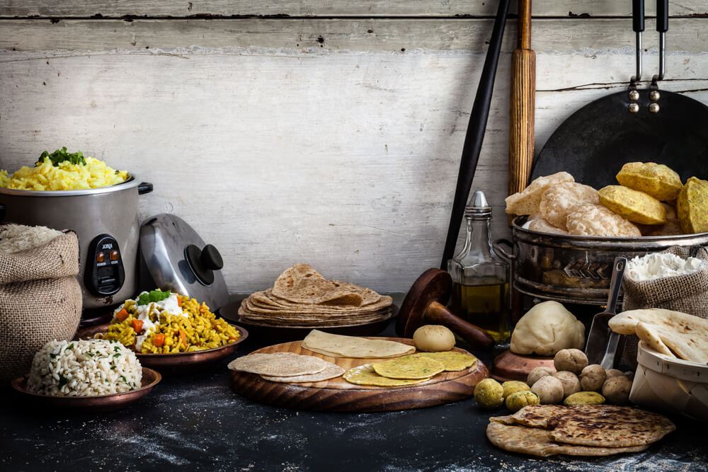 Gujarati breads and rice dishes including biryani, jeera rice, kitchdi, puri and thepla