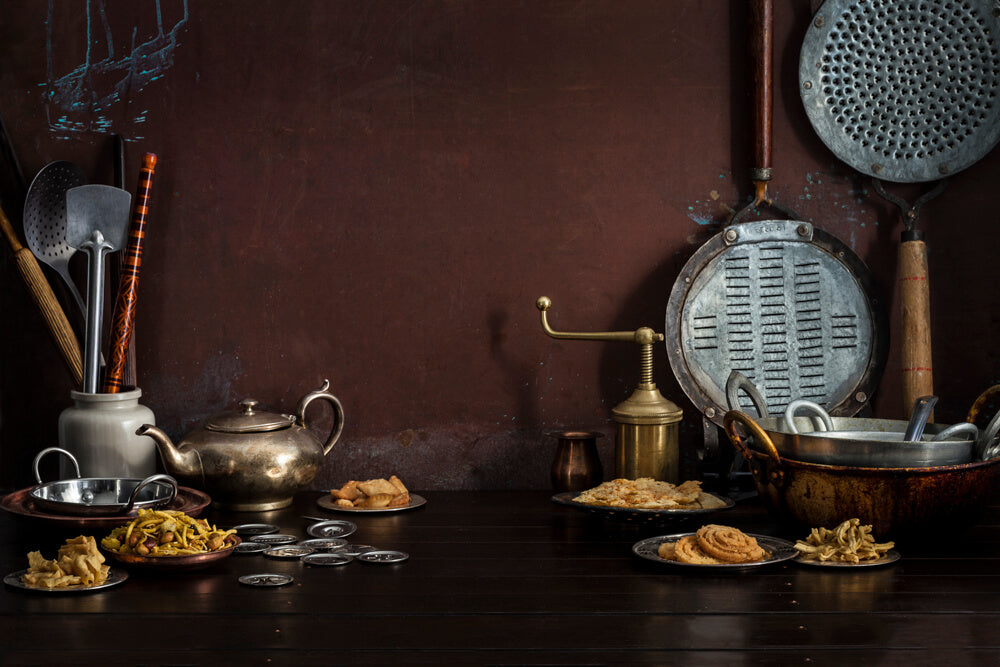 Gujarati snacks including fafda, chakri, ganthiya and chevdo with a sev maker